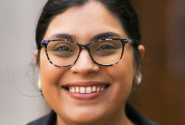 Headshot of Kiana González Cedeño wearing glasses