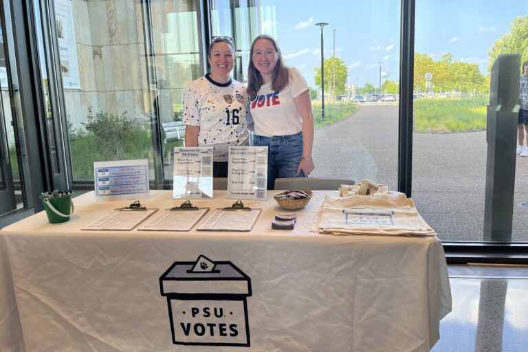 Two students tabling for PSU Votes.