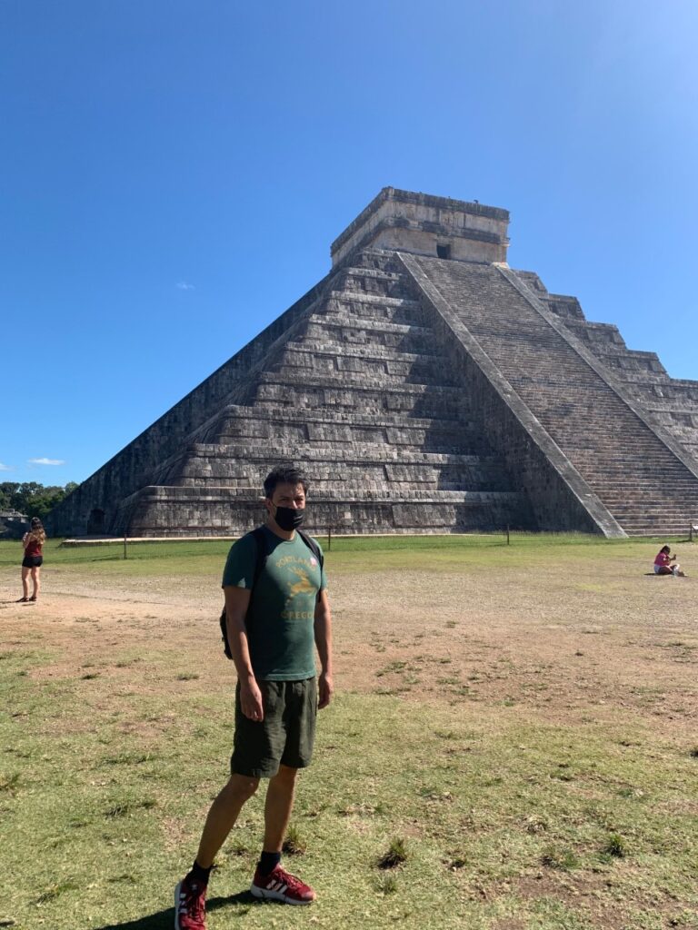 Photo of Antonio Barrenechea with a Mexican pyramid in the background.